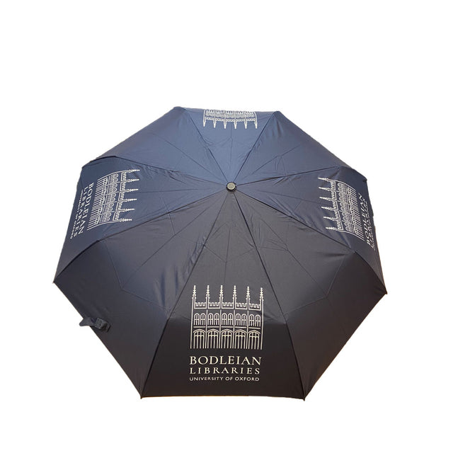 A navy umbrella with white printed patterns and text that reads 'Bodleian Libraries, University of Oxford'.