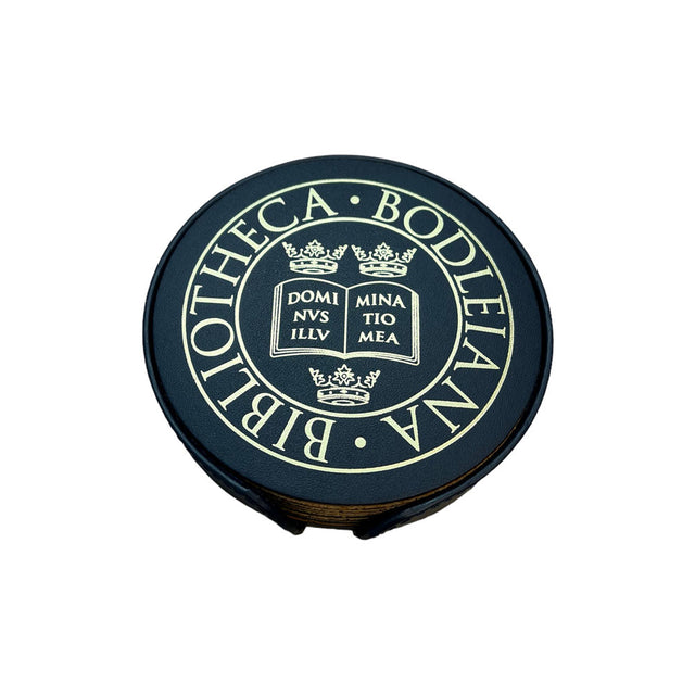 Round navy coaster with 'Bibliotheca Bodleiana' text and design on a white background
