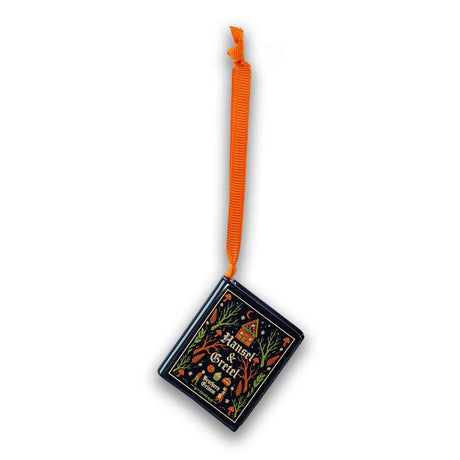 A hanging book decoration 'Hansel & Gretel Brothers Grimm' with an ornate illustrated cover and an orange pull tab, shown on a plain white background.