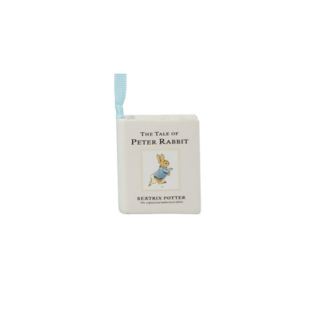 A square white book-shaped item featuring 'The Tale of Peter Rabbit' by Beatrix Potter, with a small light blue ribbon bookmark attached at the top and an illustration of Peter Rabbit on the front.