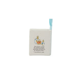 A square white ceramic ornament featuring a small illustration of Peter Rabbit and his mother with printed text, complete with a light blue ribbon loop at the top, shown on a plain white background.