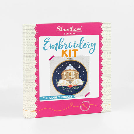 Outer box showcasing embroidery hoop with a design of  the Radcliffe Camera Library inside an open book against a night sky.